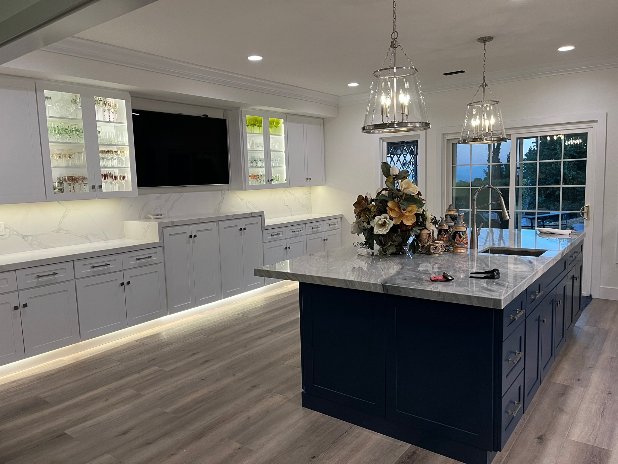 Wood-paneled bar with pool table and coffered ceiling