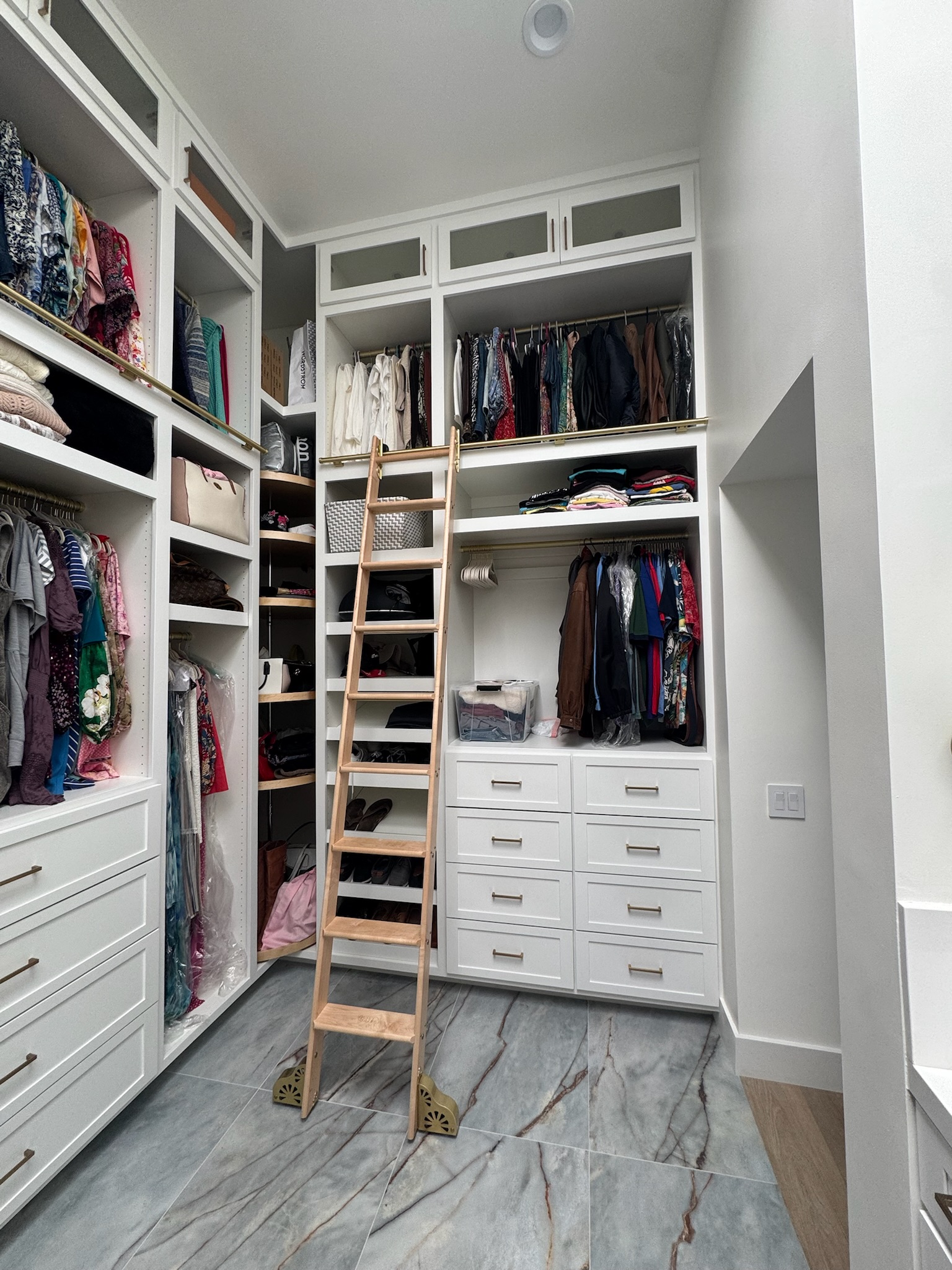 Walk-in closet with rotating shoe rack and ladder