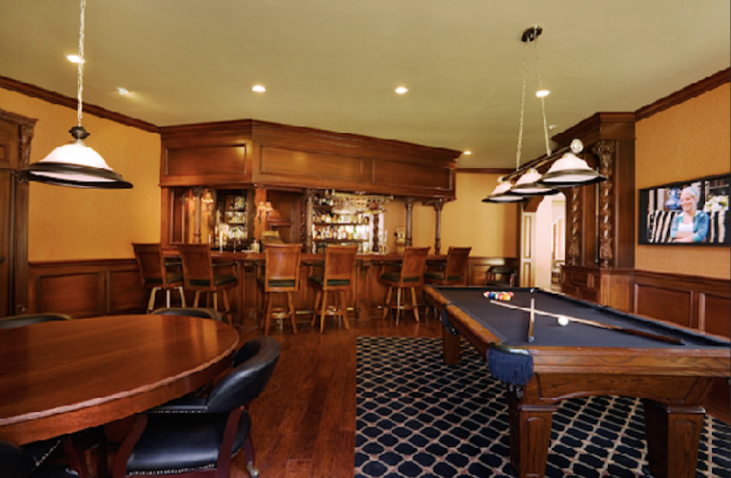Wood pub bar with billiards room and wainscoting