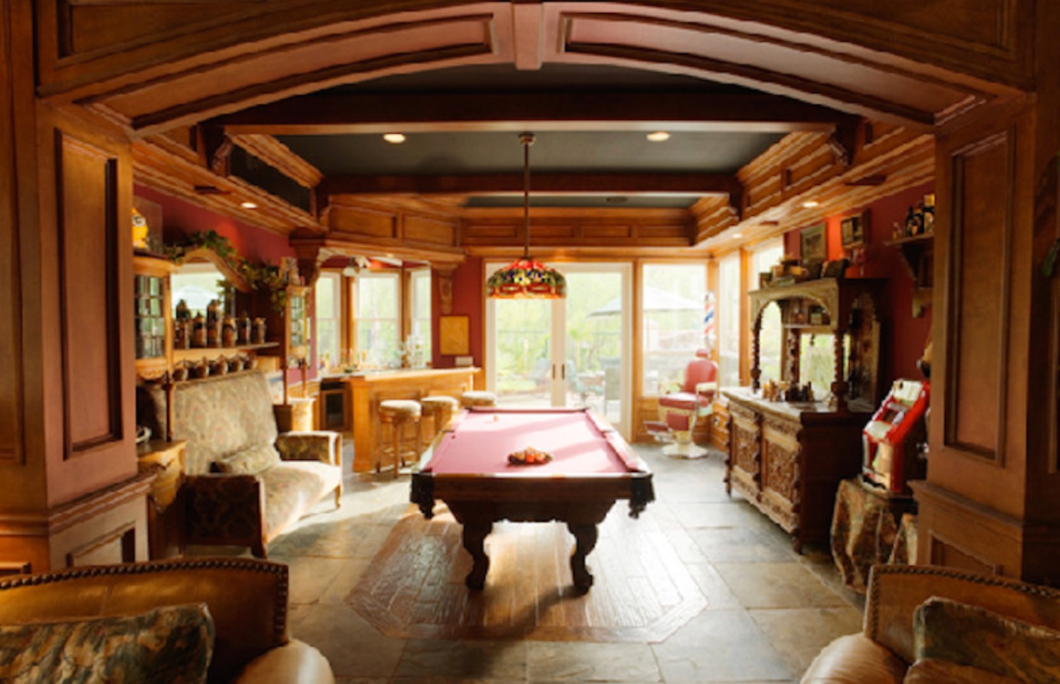 Arched wood entry to billiards and bar room
