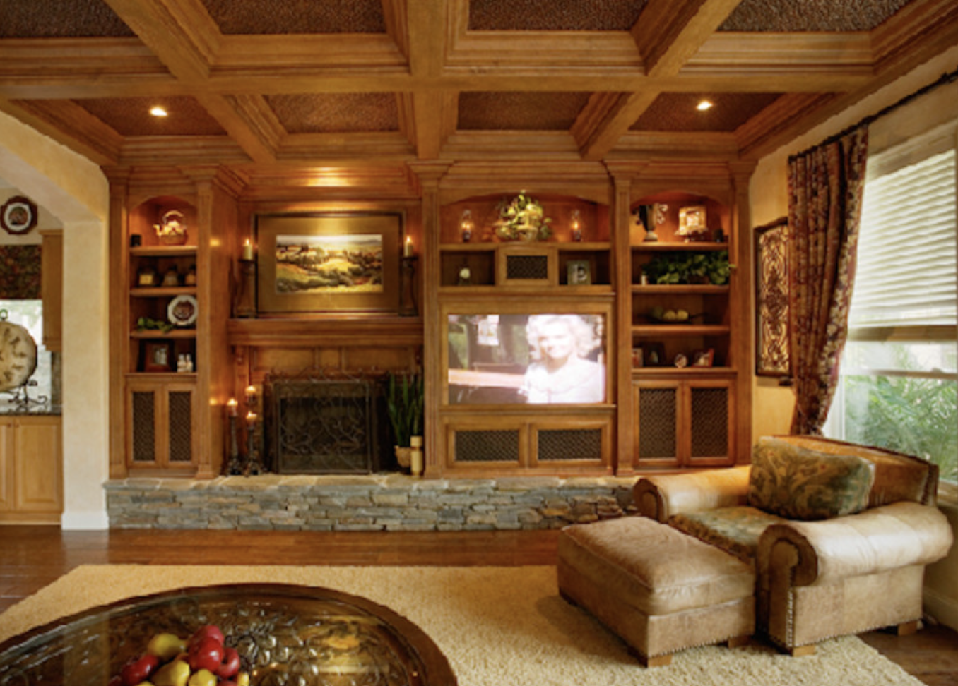 Coffered wood ceiling great room with built-in wall