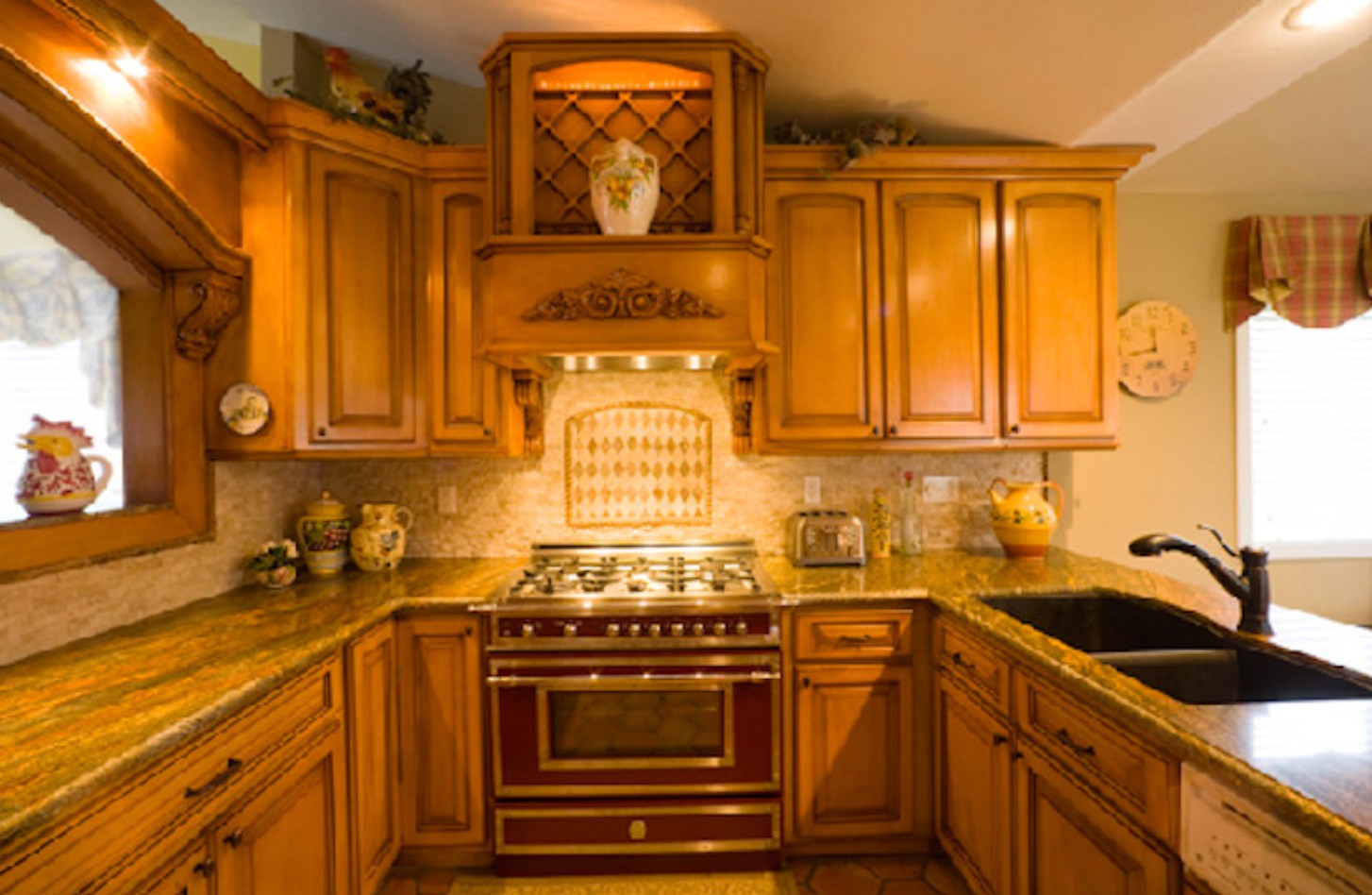 Cherry cabinetry kitchen with copper hood and island